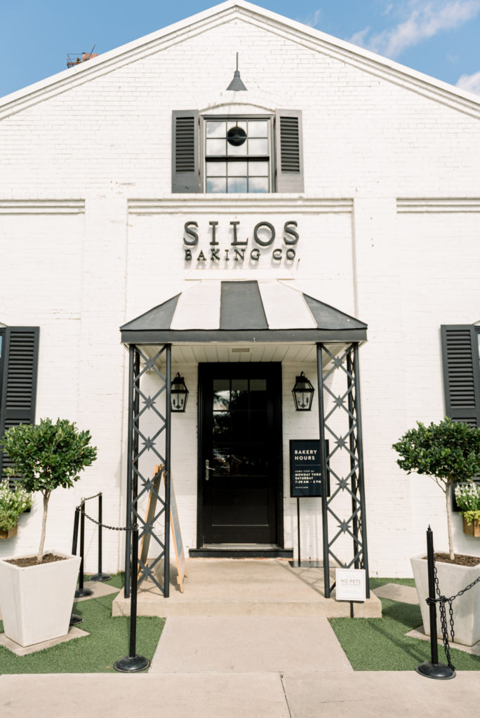 The Magnolia Market at the Silos | Magnolia Silos | Silos Baking Co | Silos Baking Co entry | White building with black accents of iron & shutter